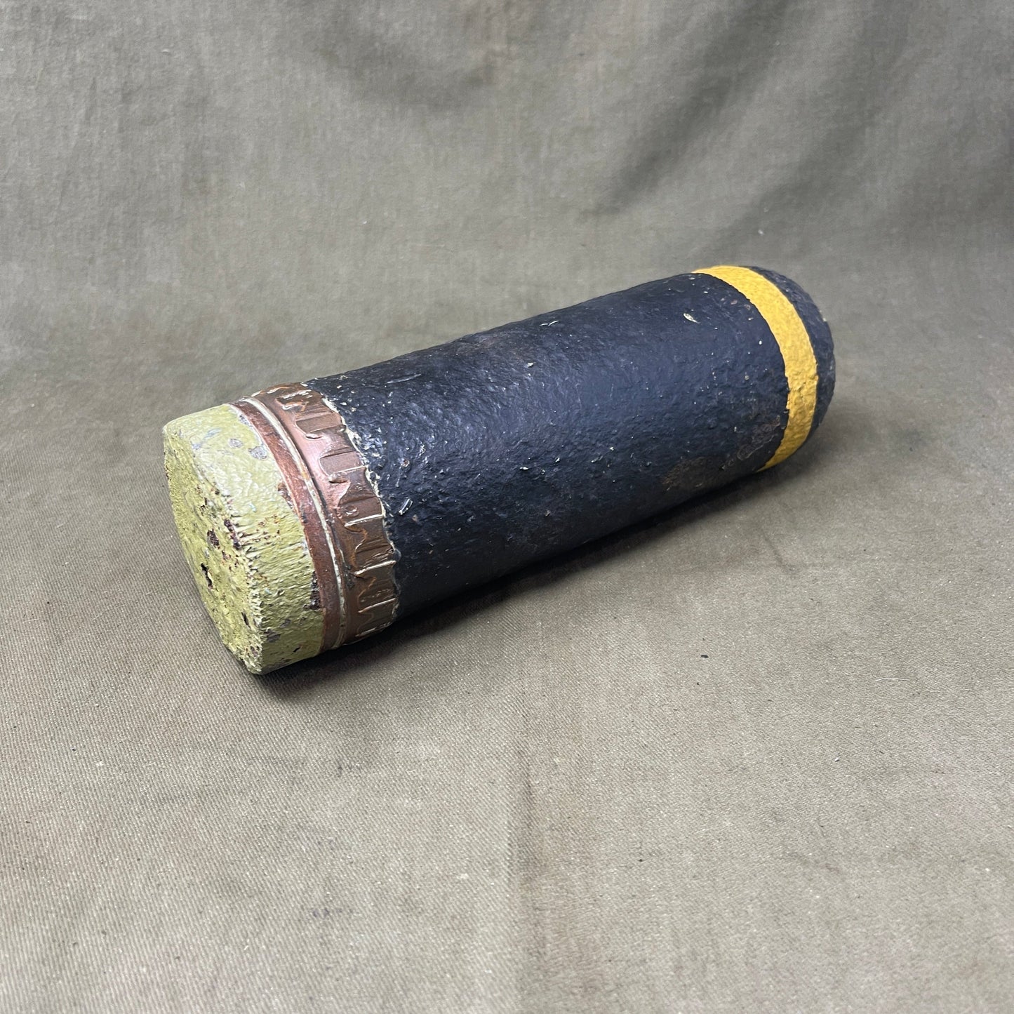 The inert 18-pounder shrapnel round was a crucial munition for the British QF (Quick Firing) 18-pounder field gun, extensively used during World War I. Designed primarily to counter infantry and soft targets, this round featured a cylindrical shell packed with hundreds of lead or steel balls, propelled by a timed fuse. Upon reaching a pre-set point in its trajectory, the fuse ignited a small bursting charge, scattering the shrapnel balls over a wide area, effectively creating a deadly hail of projectiles.