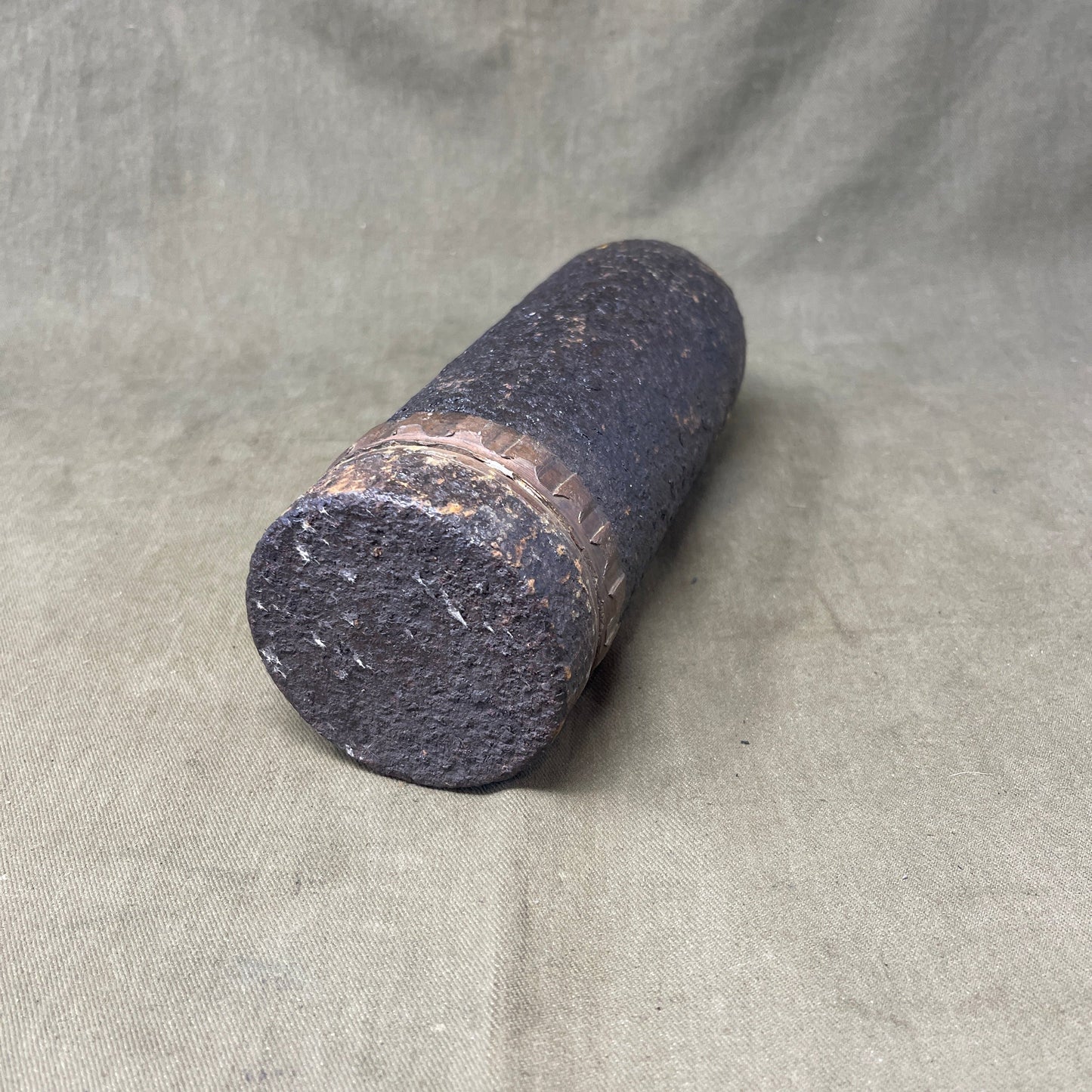 The inert 18-pounder shrapnel round was a crucial munition for the British QF (Quick Firing) 18-pounder field gun, extensively used during World War I. Designed primarily to counter infantry and soft targets, this round featured a cylindrical shell packed with hundreds of lead or steel balls, propelled by a timed fuse. Upon reaching a pre-set point in its trajectory, the fuse ignited a small bursting charge, scattering the shrapnel balls over a wide area, effectively creating a deadly hail of projectiles.