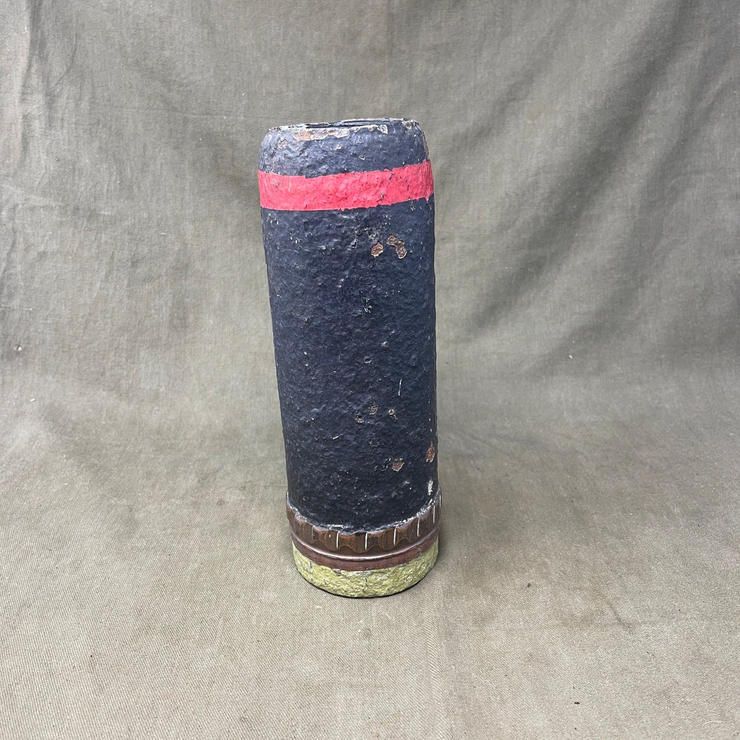 The inert 18-pounder shrapnel round was a crucial munition for the British QF (Quick Firing) 18-pounder field gun, extensively used during World War I. Designed primarily to counter infantry and soft targets, this round featured a cylindrical shell packed with hundreds of lead or steel balls, propelled by a timed fuse. Upon reaching a pre-set point in its trajectory, the fuse ignited a small bursting charge, scattering the shrapnel balls over a wide area, effectively creating a deadly hail of projectiles.
