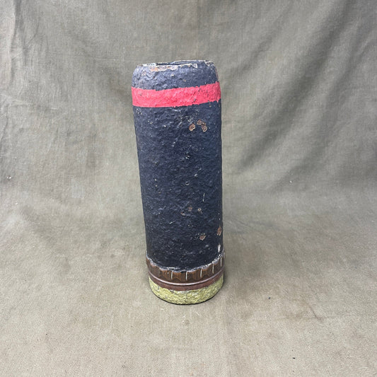 The inert 18-pounder shrapnel round was a crucial munition for the British QF (Quick Firing) 18-pounder field gun, extensively used during World War I. Designed primarily to counter infantry and soft targets, this round featured a cylindrical shell packed with hundreds of lead or steel balls, propelled by a timed fuse. Upon reaching a pre-set point in its trajectory, the fuse ignited a small bursting charge, scattering the shrapnel balls over a wide area, effectively creating a deadly hail of projectiles.