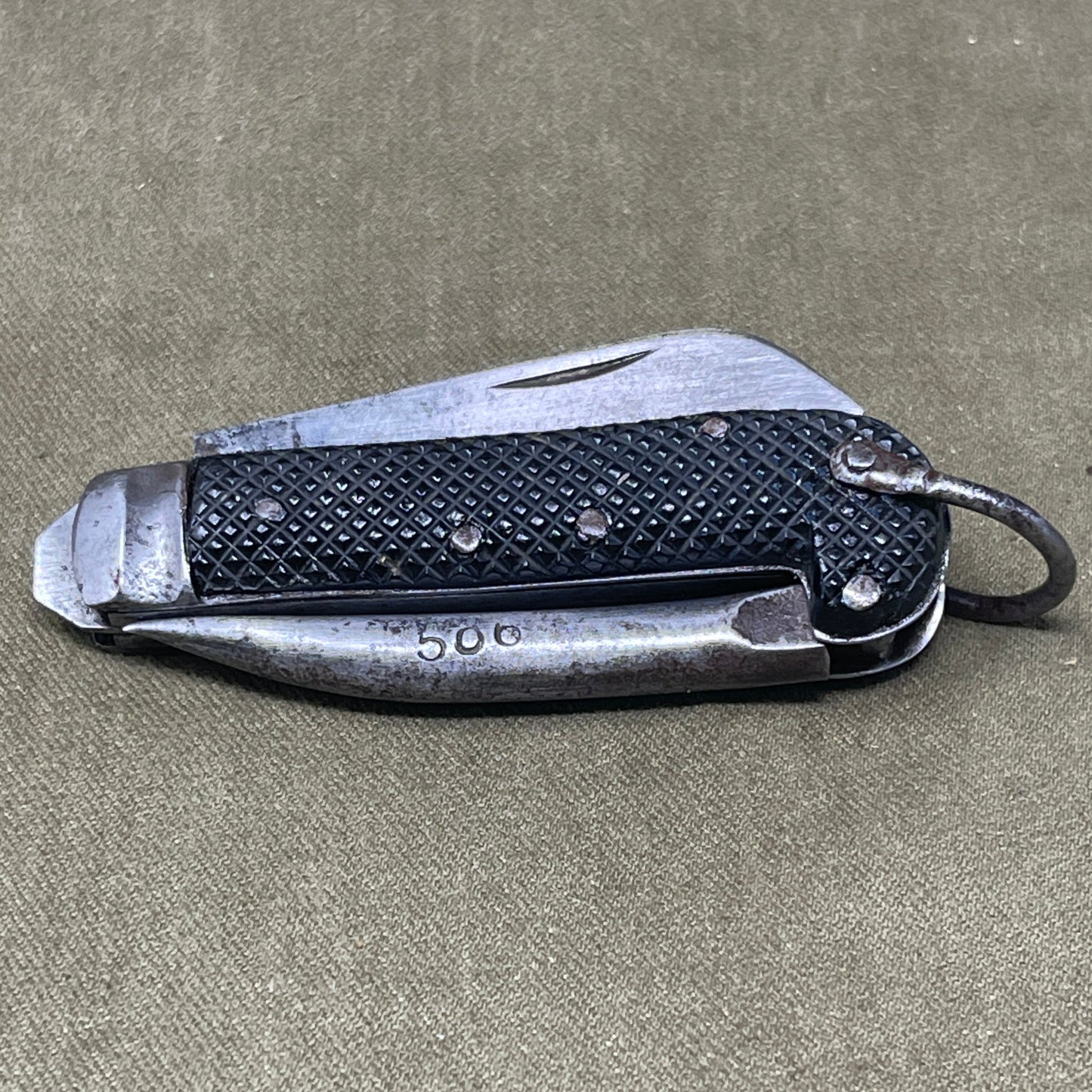 A nice example of a British 1943 Dated Pocket Jack Knife made by Humphreys Radiant of Sheffield The blades are in good condition, the chequered Bakelite grip is intact and all the blades lock and close as they should. The steel can opener is in good condition