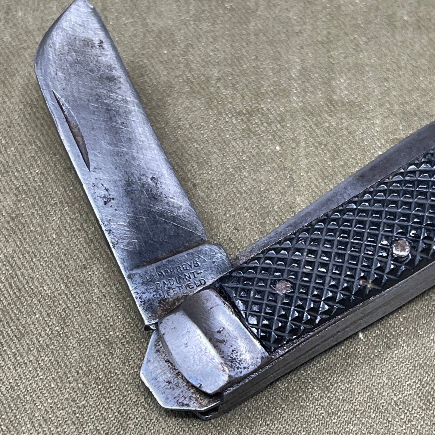 A nice example of a British 1943 Dated Pocket Jack Knife made by Humphreys Radiant of Sheffield The blades are in good condition, the chequered Bakelite grip is intact and all the blades lock and close as they should. The steel can opener is in good condition