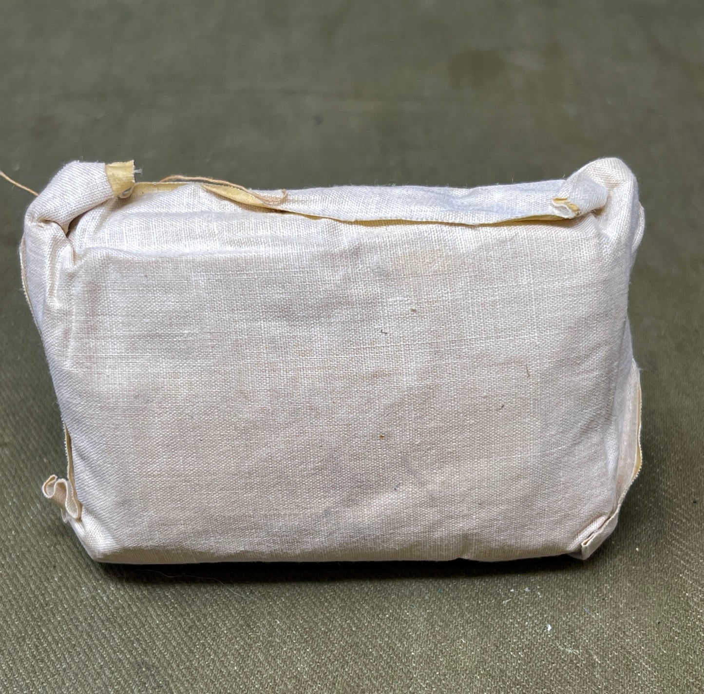 This Large First Aid Dressing, manufactured by T.J. Smith & Nephew Ltd in Hull, England, is a vintage medical supply that highlights the craftsmanship and practical design of mid-20th-century healthcare essentials. Known for its reliability and quality, Smith & Nephew was a renowned manufacturer of medical and surgical products, and this dressing reflects their commitment to excellence.
The dressing is designed for emergency use, providing a sterile and absorbent solution for treating wounds, cuts, or inju