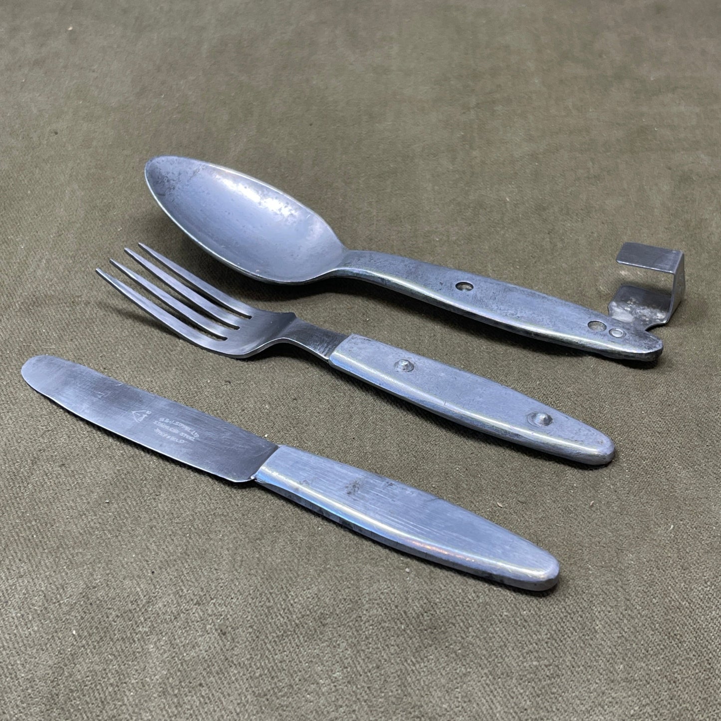 Knife, fork, and Spoon set dated 1945 Compactium
