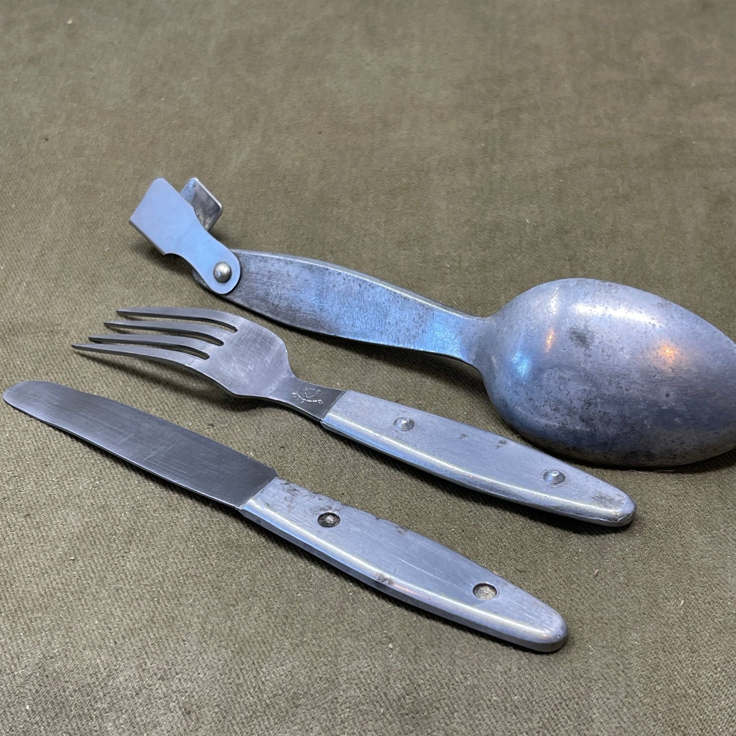 Knife, fork, and Spoon set dated 1945 Compactium