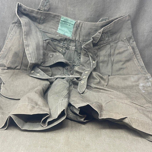 Original 1950s British Army Jungle Green shorts, locally made, Size 3 (30"-31" waist). Excellent condition with classic military design—ideal for collectors or re-enactors.