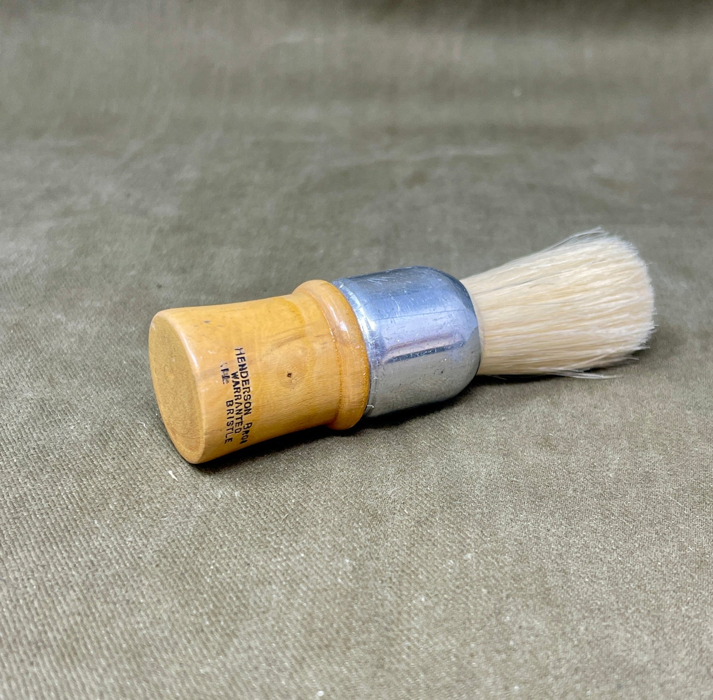 Shop this original 1939-dated Henderson Bros WW2 British Army shaving brush. Warranted bristle, military-issued, and ideal for collectors of wartime memorabilia.