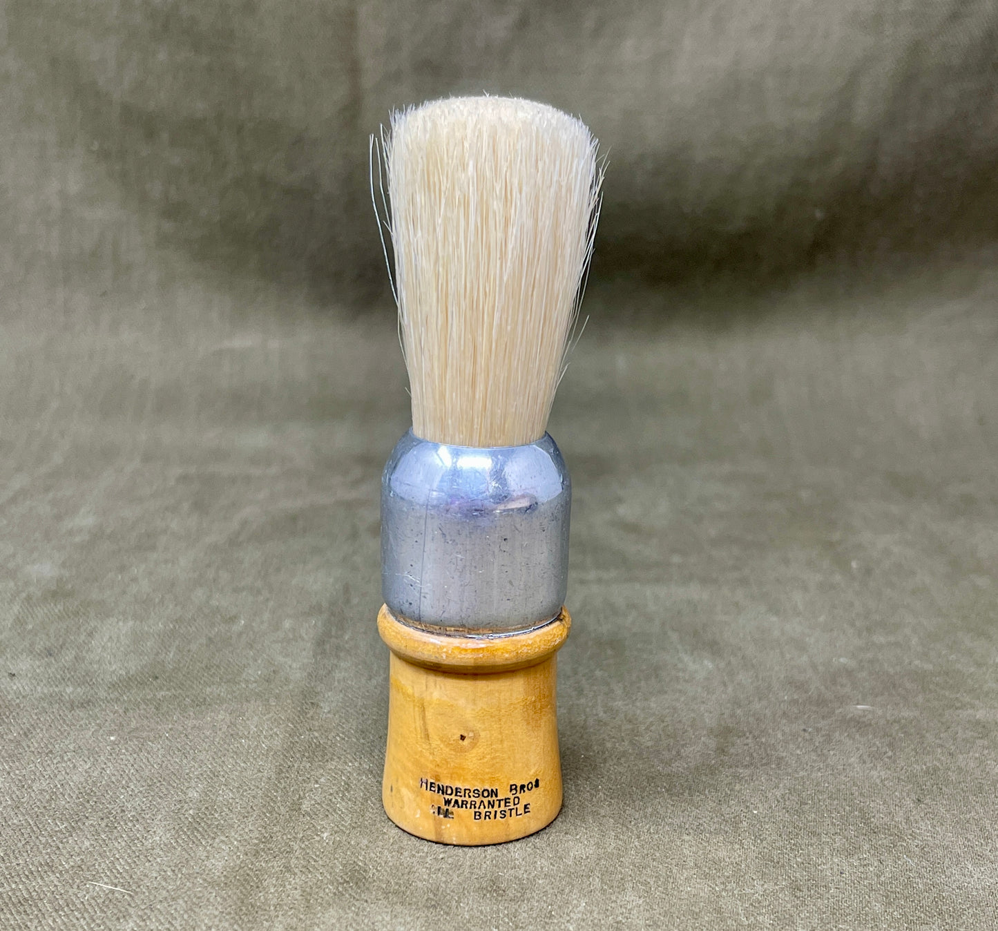 Shop this original 1939-dated Henderson Bros WW2 British Army shaving brush. Warranted bristle, military-issued, and ideal for collectors of wartime memorabilia.