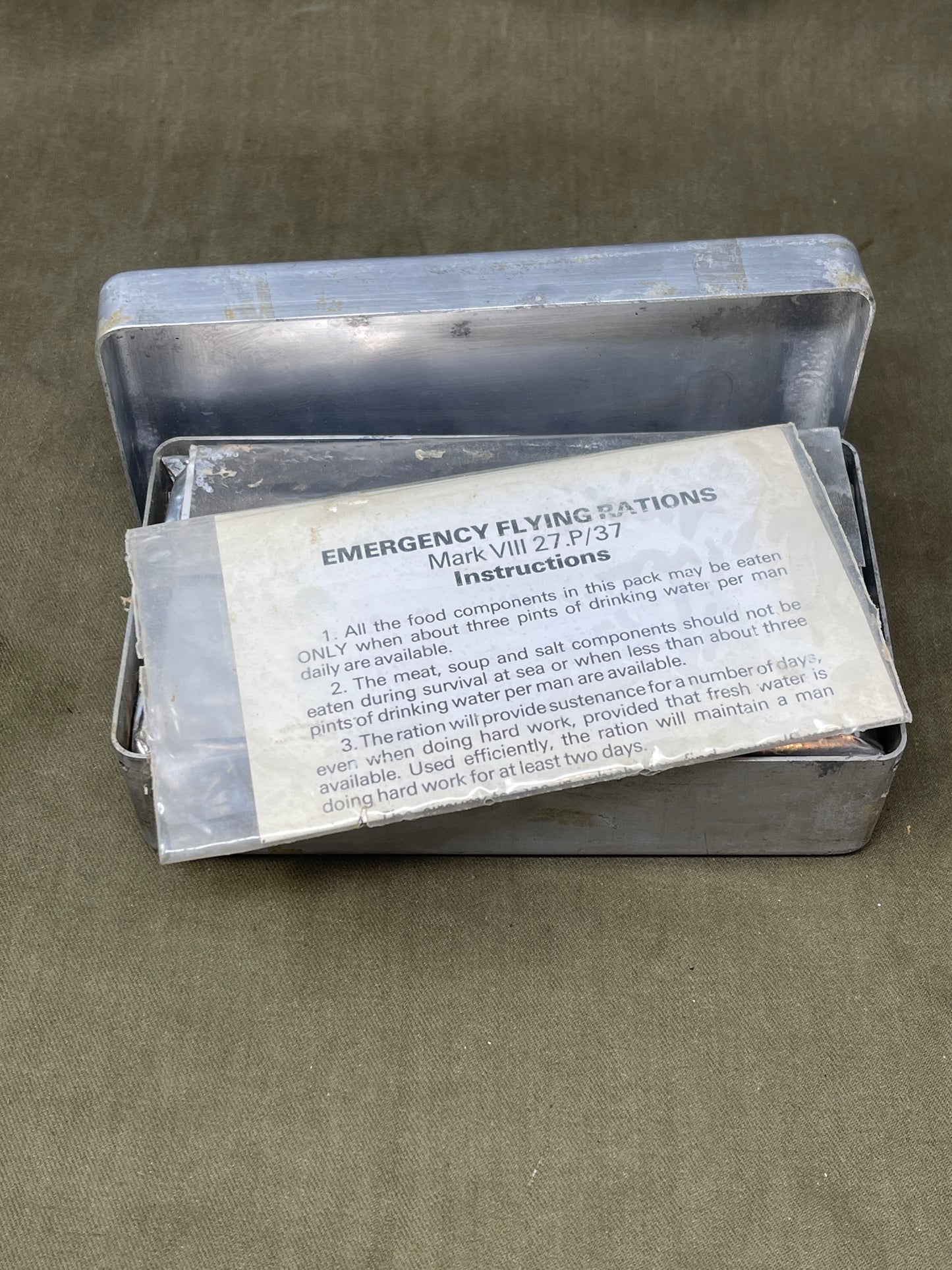 Shop a complete Royal Air Force Mark VIII Emergency Flying Rations tin (27P P.D/74). Rare WW2 survival kit issued to RAF aircrew—perfect for collectors.