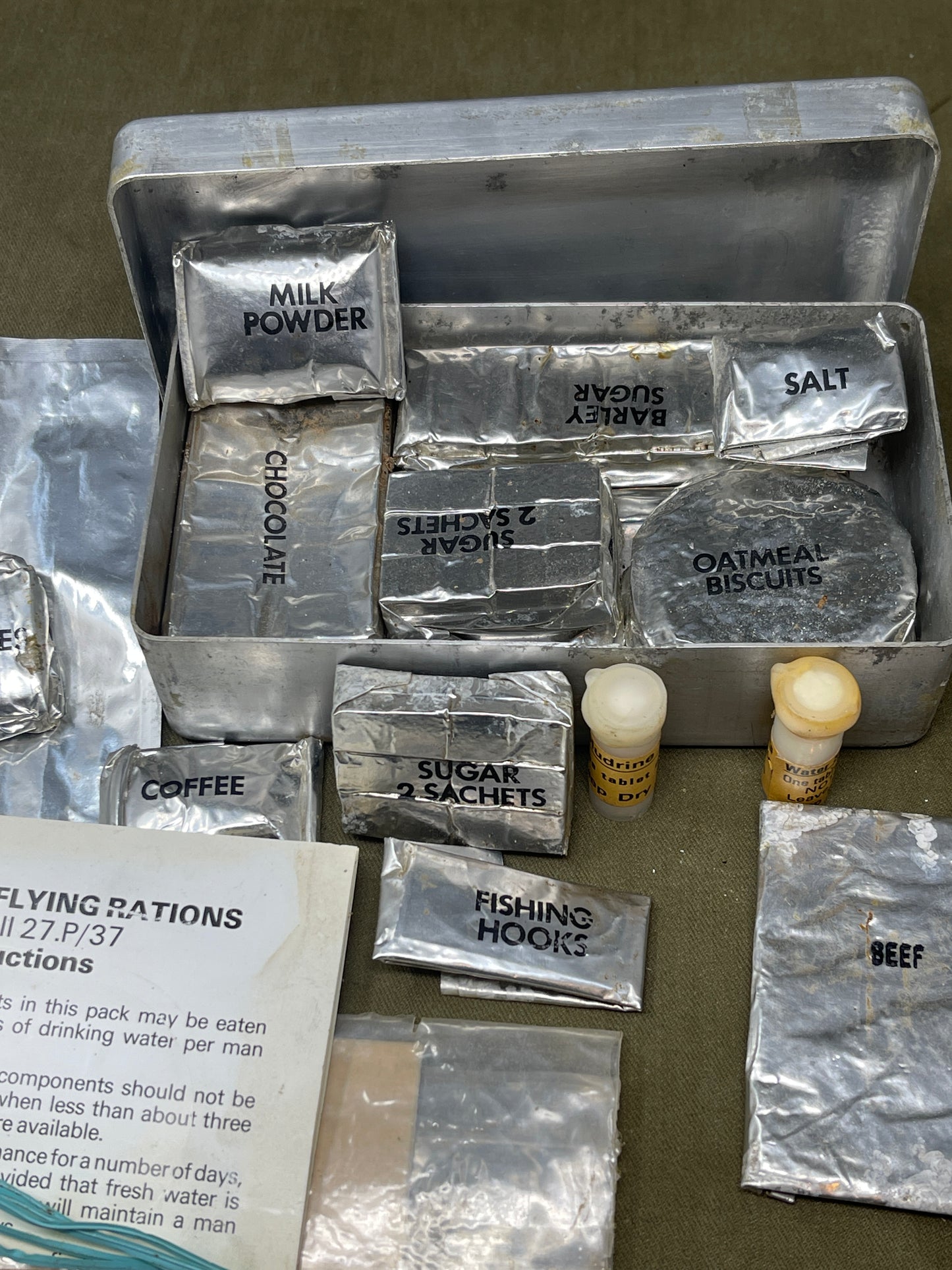 Shop a complete Royal Air Force Mark VIII Emergency Flying Rations tin (27P P.D/74). Rare WW2 survival kit issued to RAF aircrew—perfect for collectors.