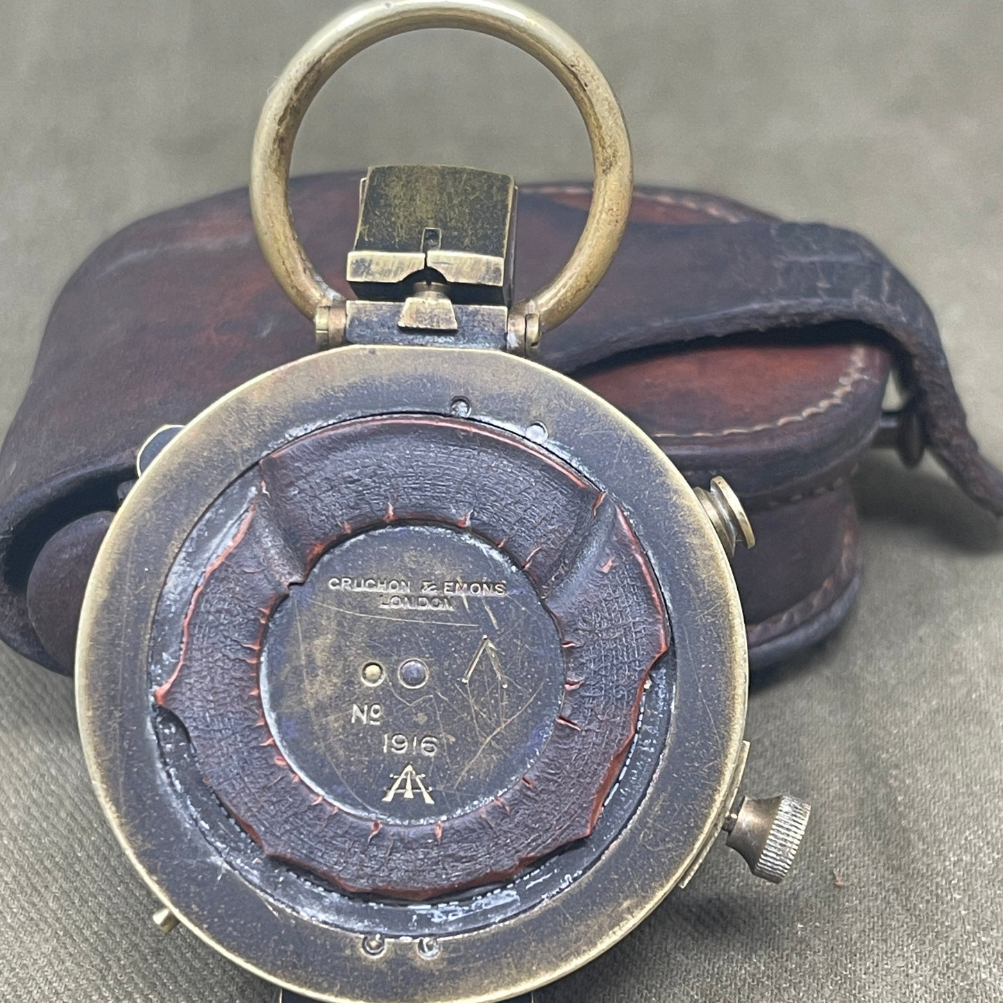 Authentic 1916 British WWI military compass by Cruchon & Emons, London. Excellent condition with original leather case. A rare and collectible Great War navigation instrument.