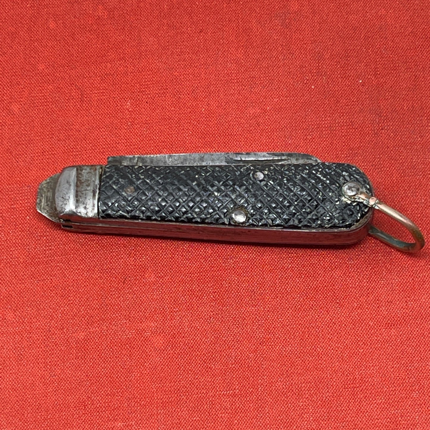 A nice example of a British Jack Knife, dated 1940 The blades are in good condition, the chequered Bakelite grip is intact and all the blades lock and close as they should. The steel can opener is in good condition