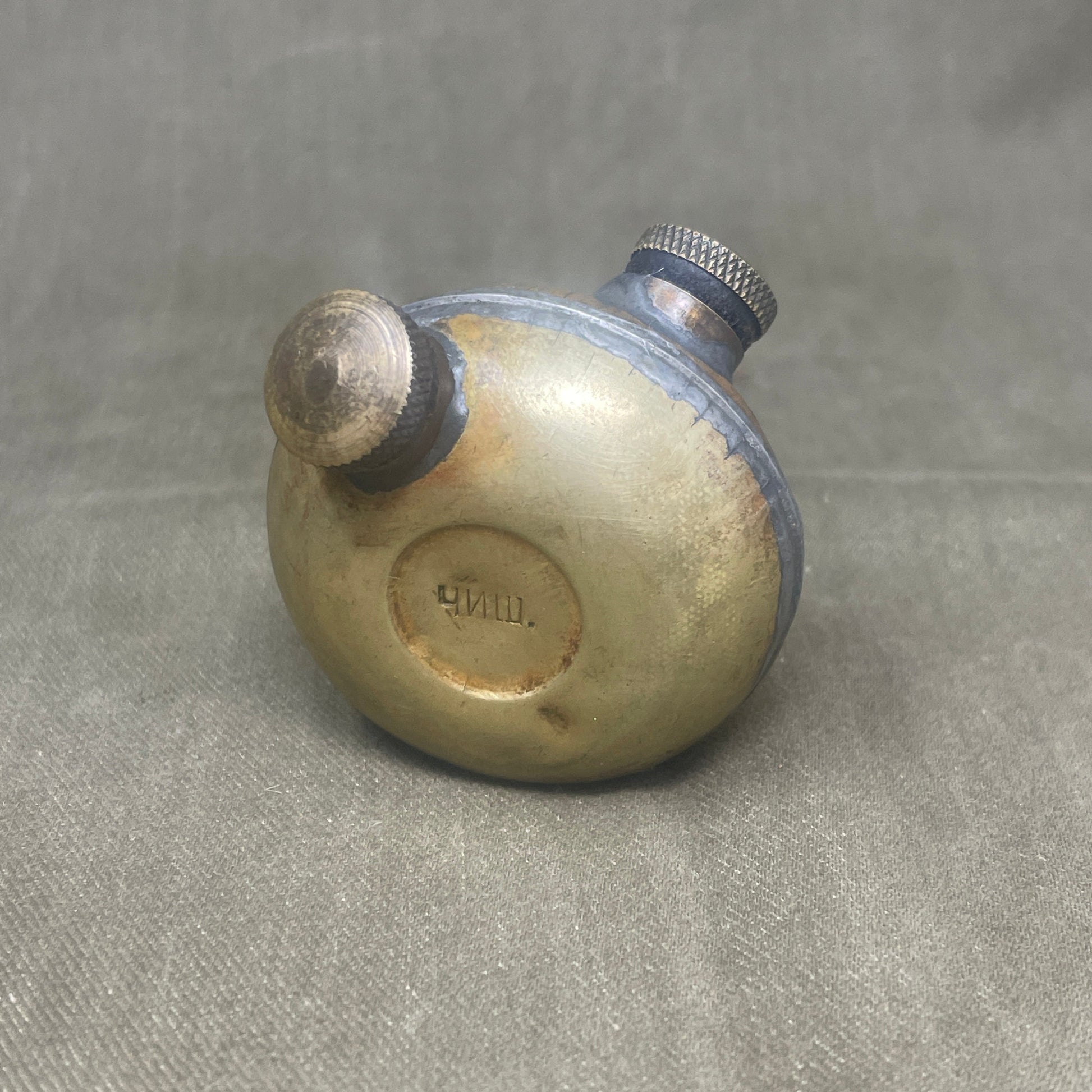 Vintage-style bicycle bell on a textured gray background