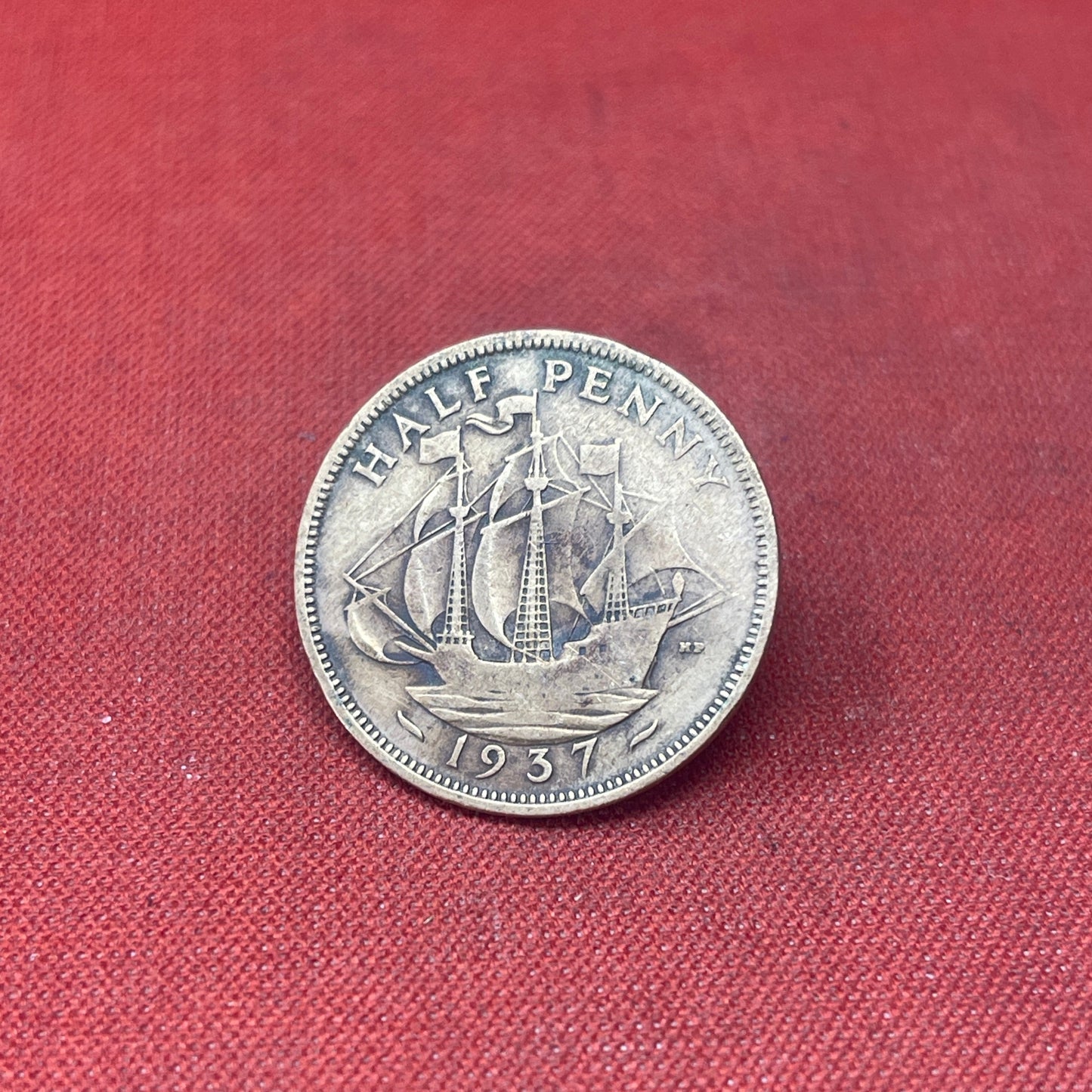Explore the historical significance of the King George VI 1937 Half Penny. This iconic coin features the Golden Hind and the portrait of George VI, perfect for collectors and history enthusiasts