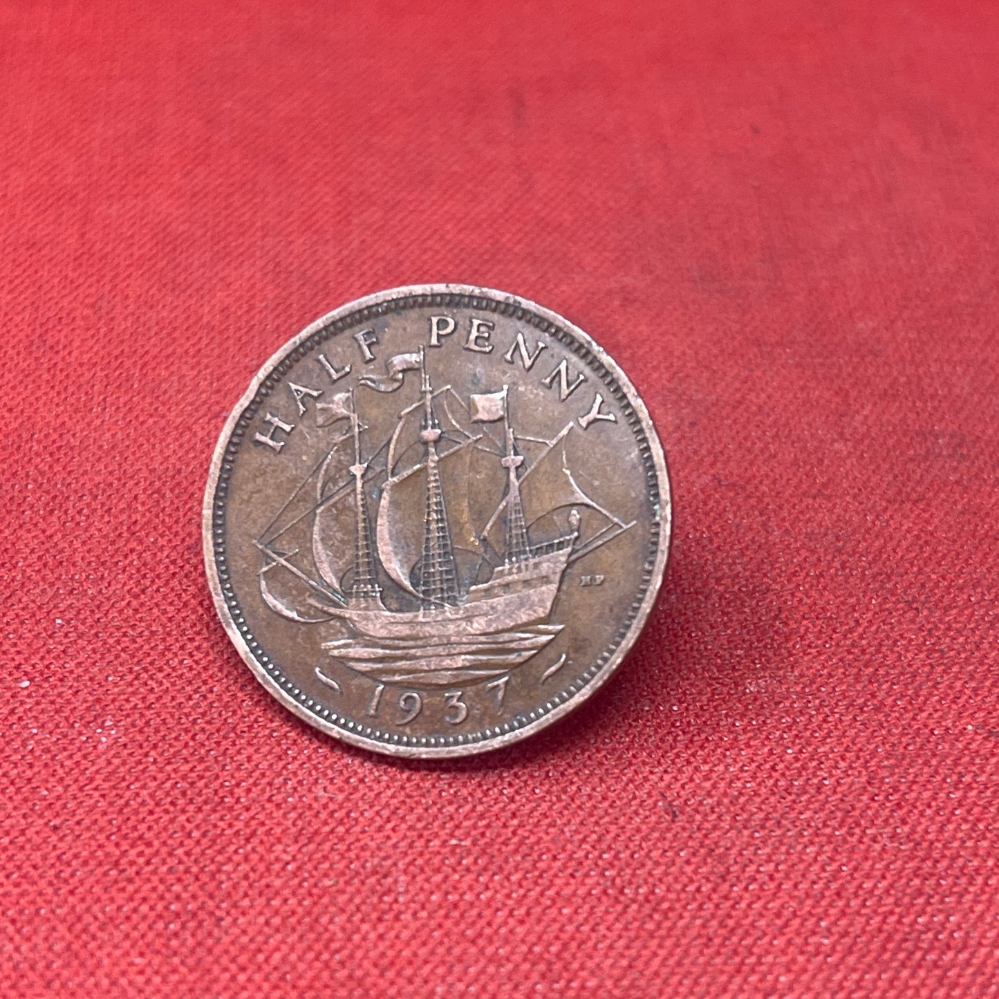 Explore the historical significance of the King George VI 1937 Half Penny. This iconic coin features the Golden Hind and the portrait of George VI, perfect for collectors and history enthusiasts