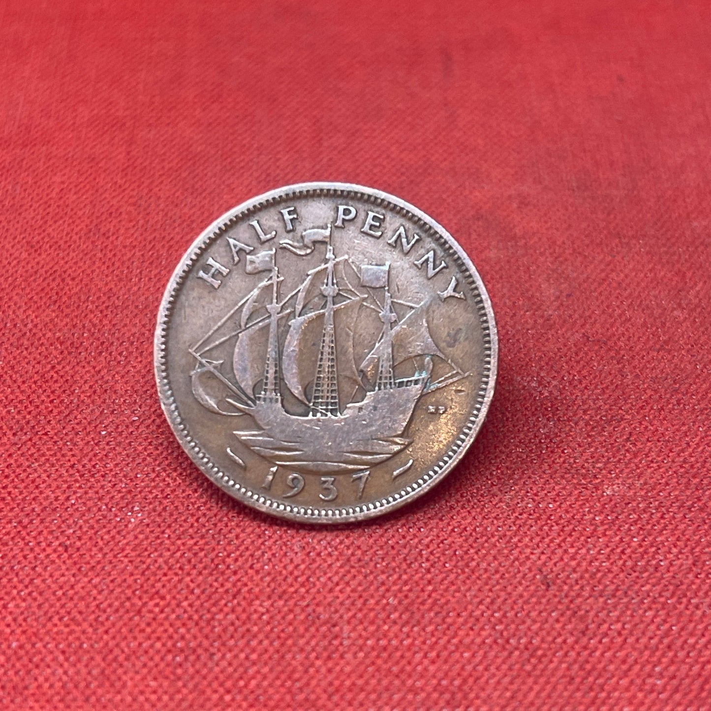 Explore the historical significance of the King George VI 1937 Half Penny. This iconic coin features the Golden Hind and the portrait of George VI, perfect for collectors and history enthusiasts