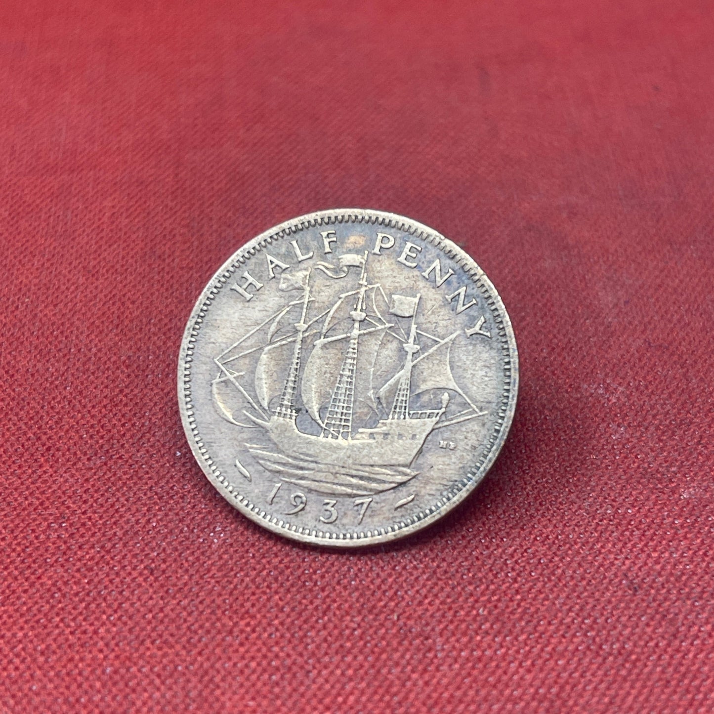Explore the historical significance of the King George VI 1937 Half Penny. This iconic coin features the Golden Hind and the portrait of George VI, perfect for collectors and history enthusiasts