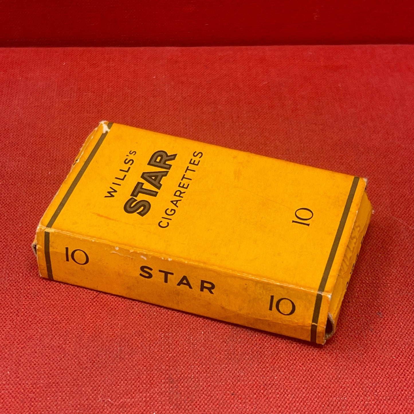 A box of Wills STAR cigarettes refers to a brand of cigarettes produced by W.D. & H.O. Wills, a prominent British tobacco company.