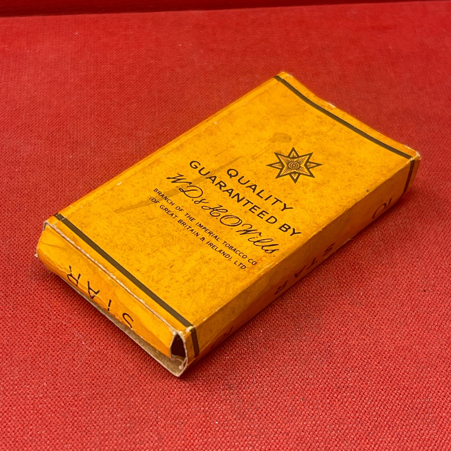A box of Wills STAR cigarettes refers to a brand of cigarettes produced by W.D. & H.O. Wills, a prominent British tobacco company.