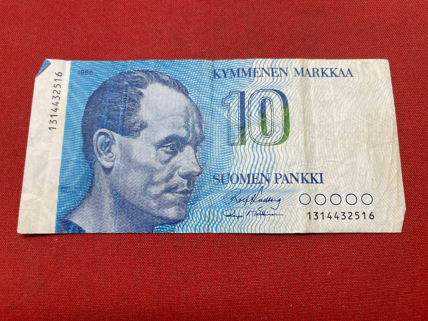 Blue. Portrait of Paavo Nurmi (1897-1973), the famous Finnish middle distance and long distance runner, known as the 'Flying Finn' .