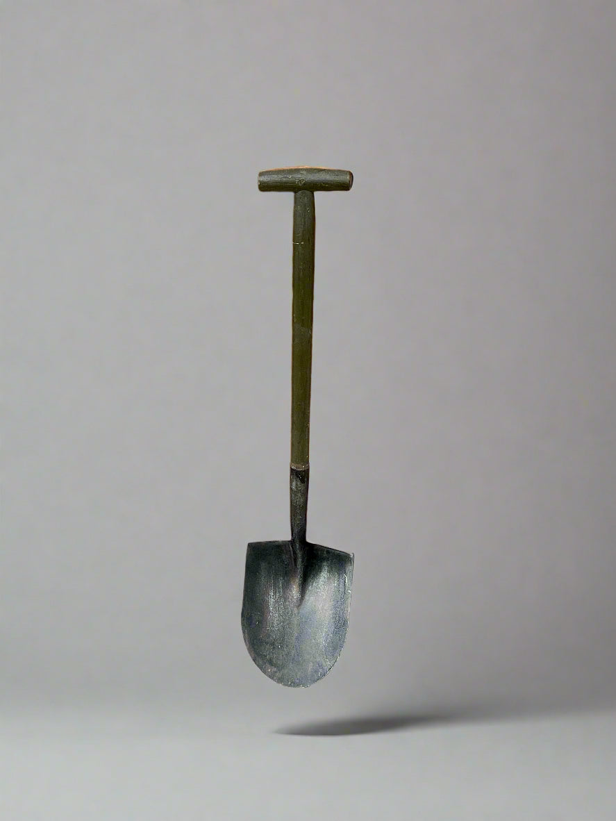 Metal door handle on a brick wall with concrete floor