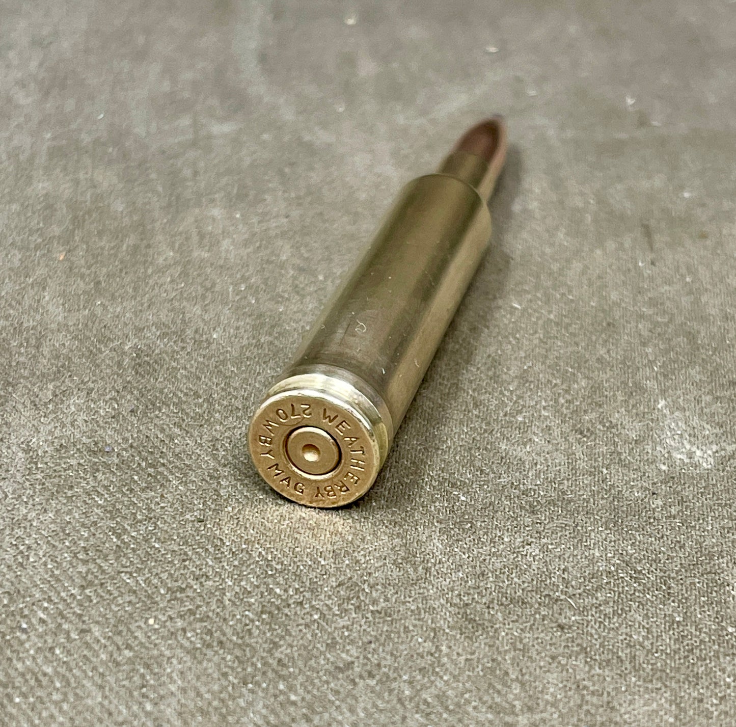Bullseye Weatherproof metal rod on a textured gray surface