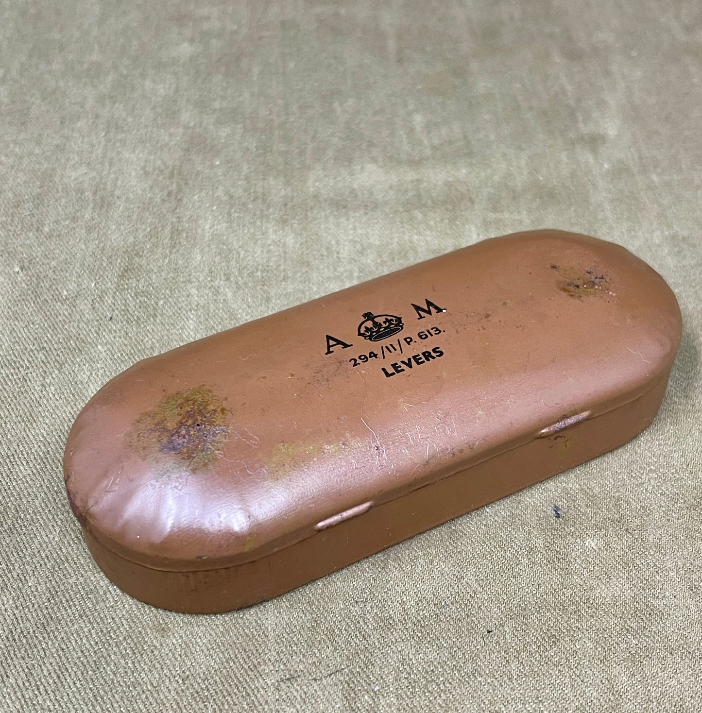 Brown eyeglass case with 'A & M Levers' branding on a textured surface
