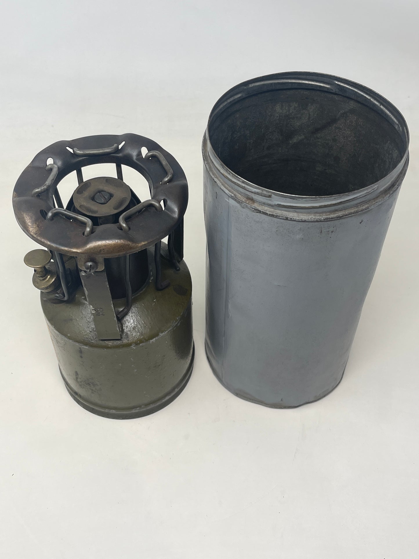 An original WW2 "Hurlock " field cooker next to container