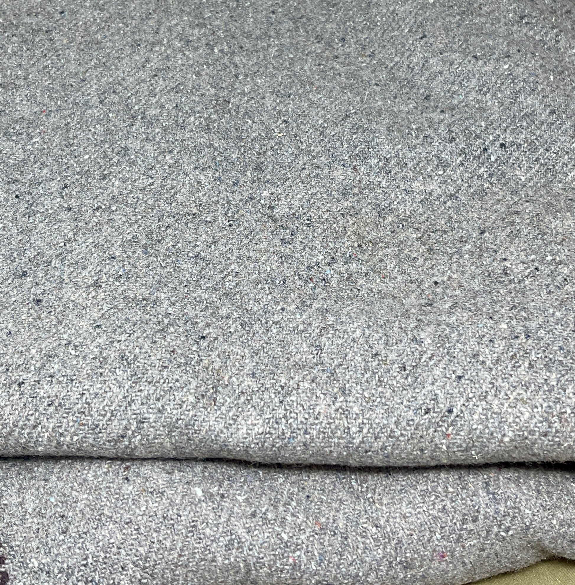 Close-up of gray fabric with a textured pattern