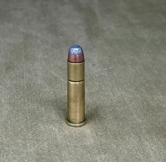 Bullet casing on a textured gray surface