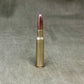 Bullet casing on a textured gray background