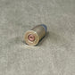 Bullet casing on a concrete surface