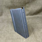 Metal magazine on a textured gray background