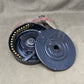 Close-up of a mechanical component on a beige fabric background