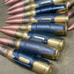 Row of rifle cartridges on a textured surface