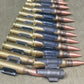 Row of rifle cartridges on a textured surface