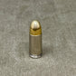Bullet on a textured gray surface
