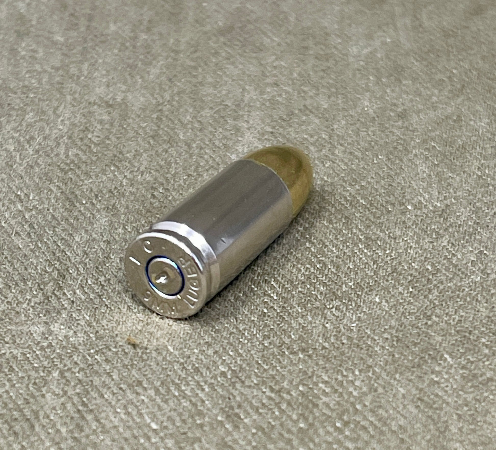 Bullet casing on a textured surface