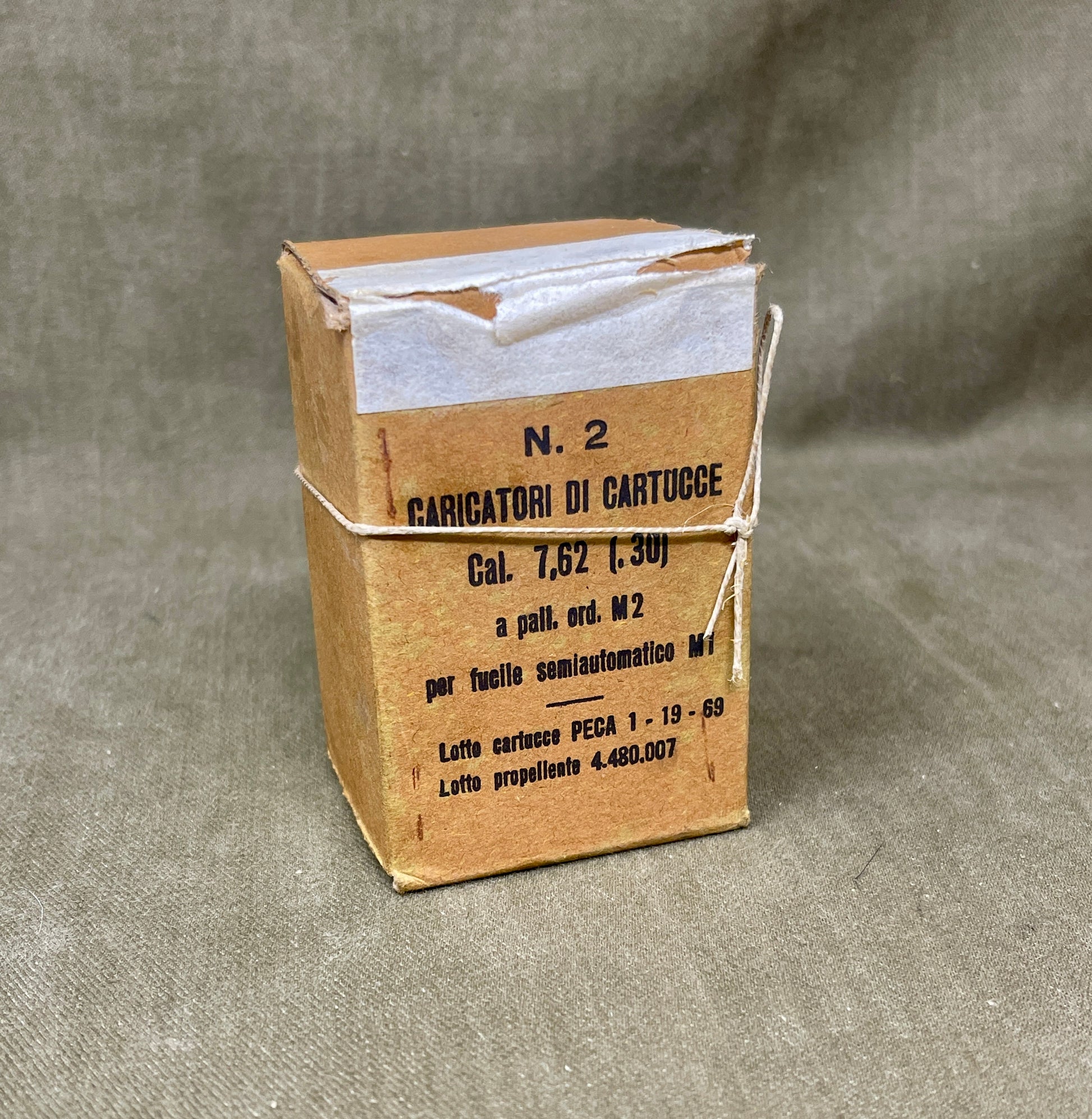 Cardboard box with text on a gray background