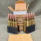 Ammunition with a cardboard box on a gray background