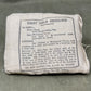 First field dressing package with text on a gray background