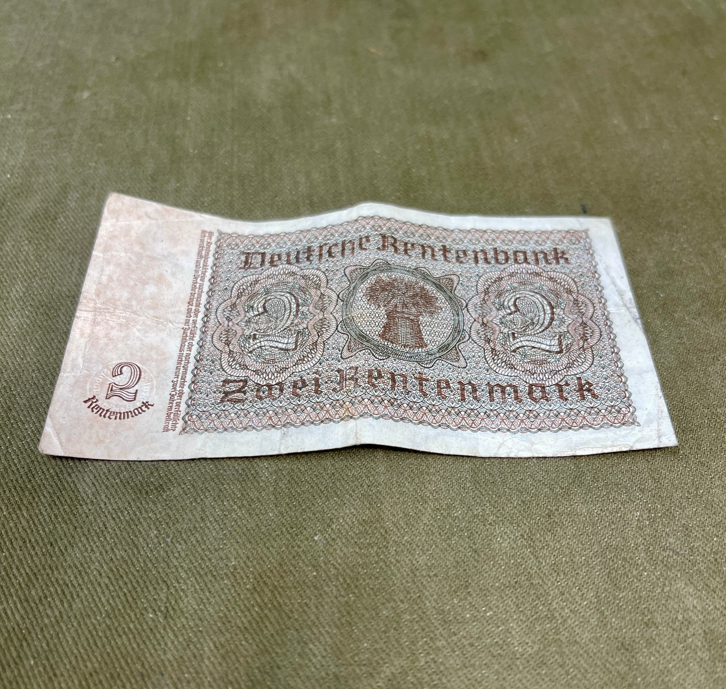 Vintage German banknote from Deutsche Rentenbank on a textured surface