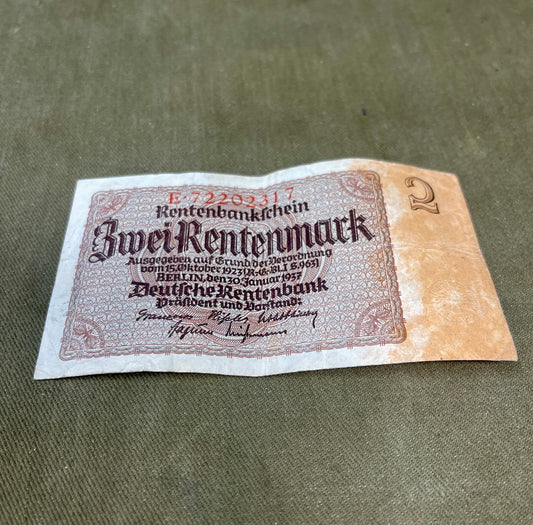 Vintage German banknote on a textured surface