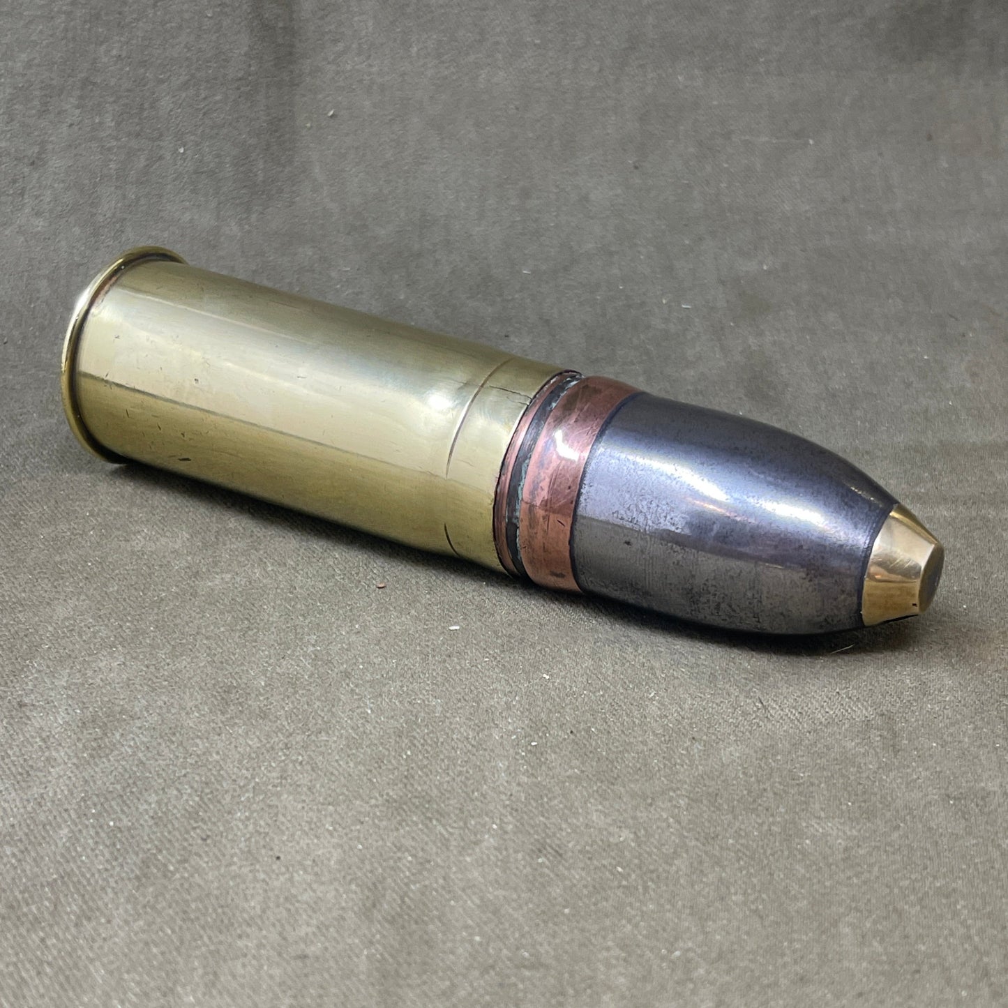 An inert Vickers Sons & Maxim 37 mm projectile and case