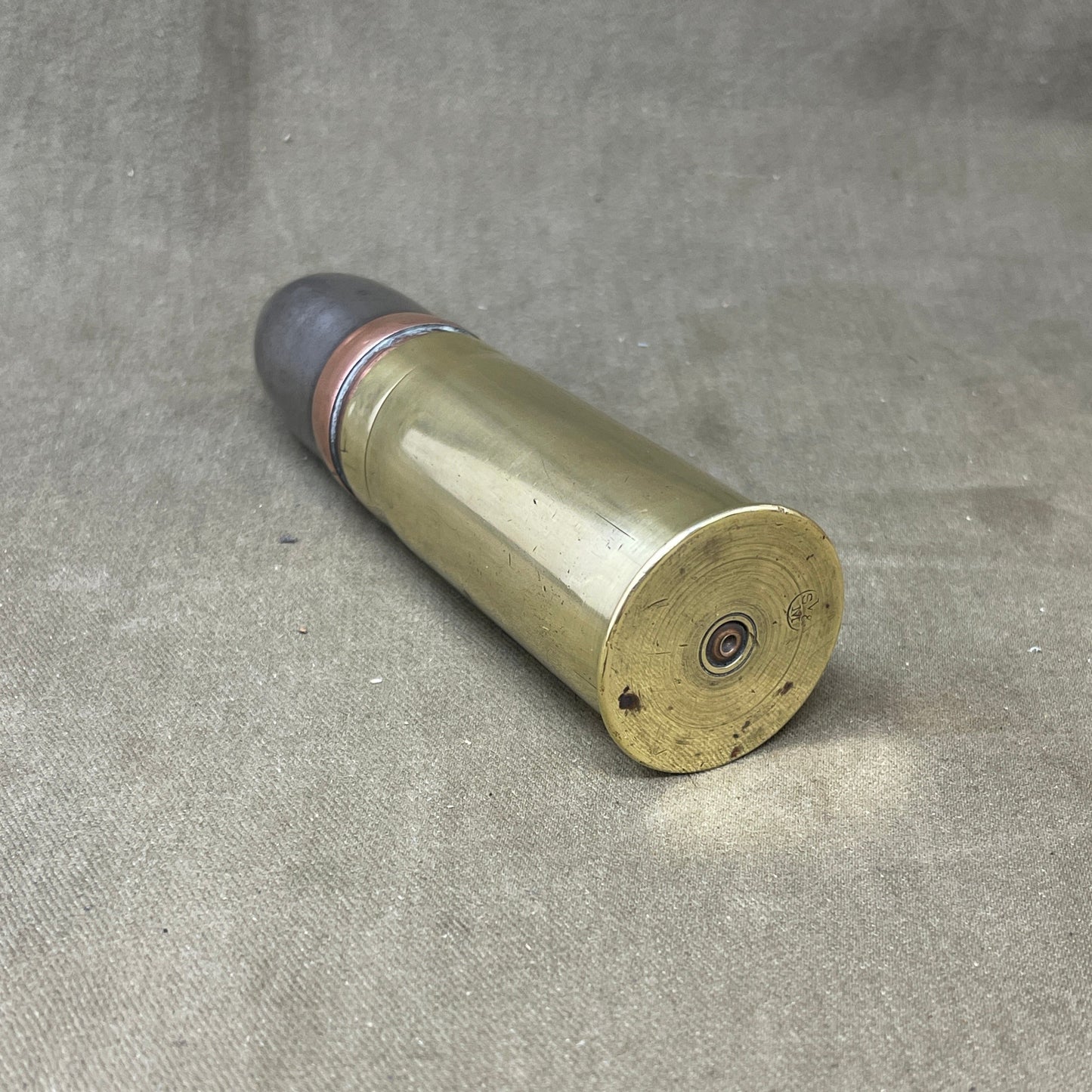 An inert Vickers Sons & Maxim 37 mm projectile and case