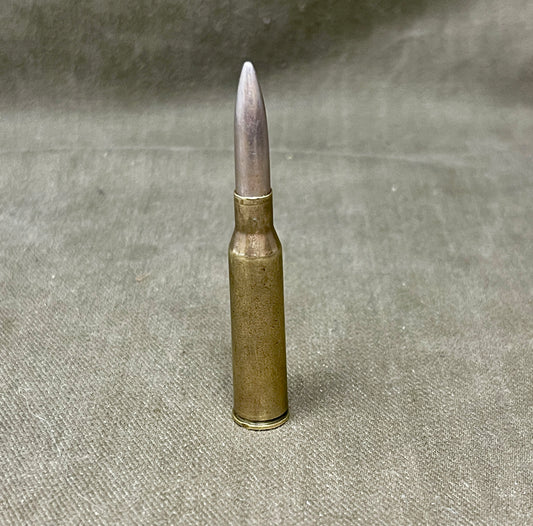 Bullet casing on a textured gray background