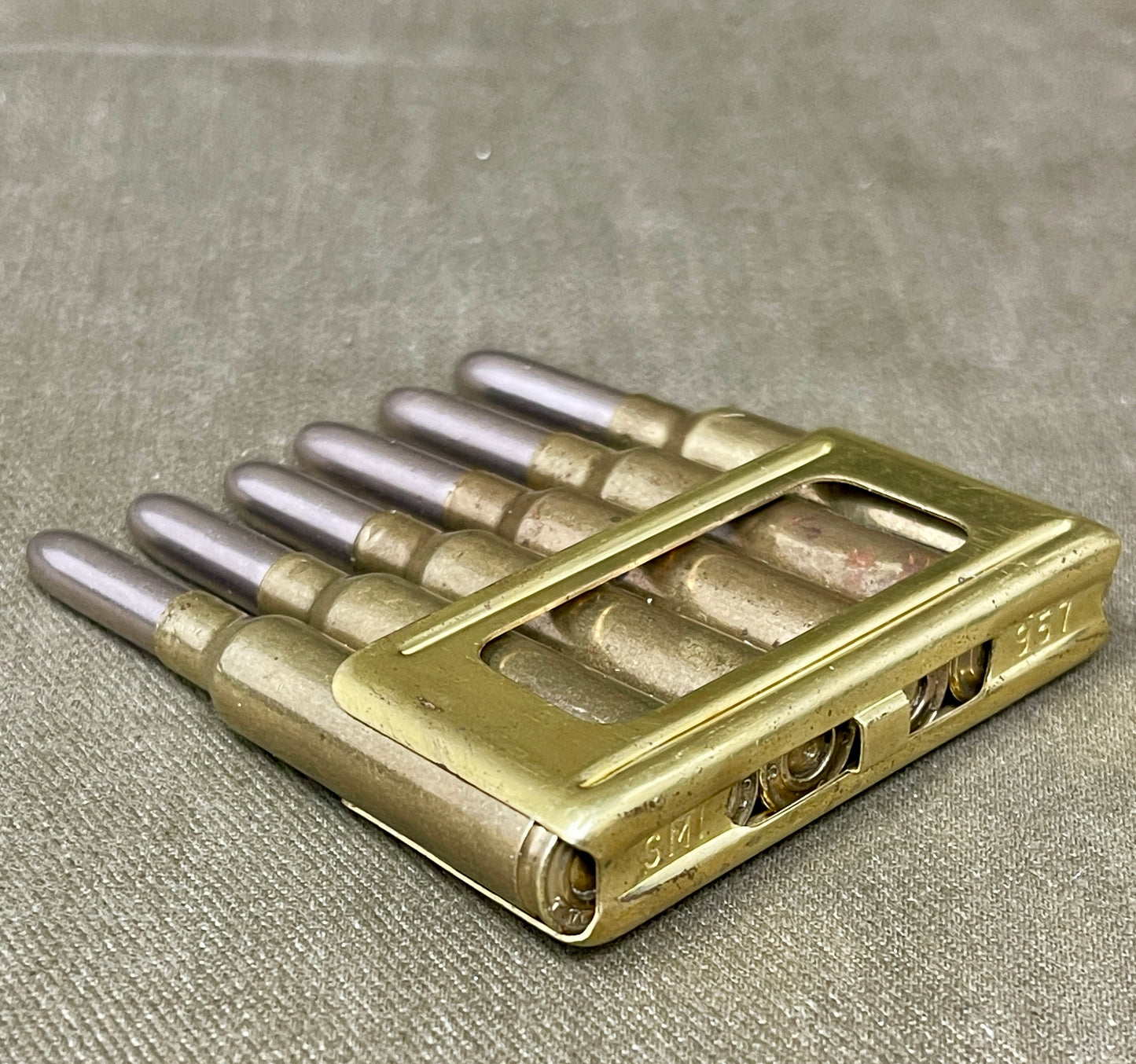 Metallic object with cylindrical components on a textured surface