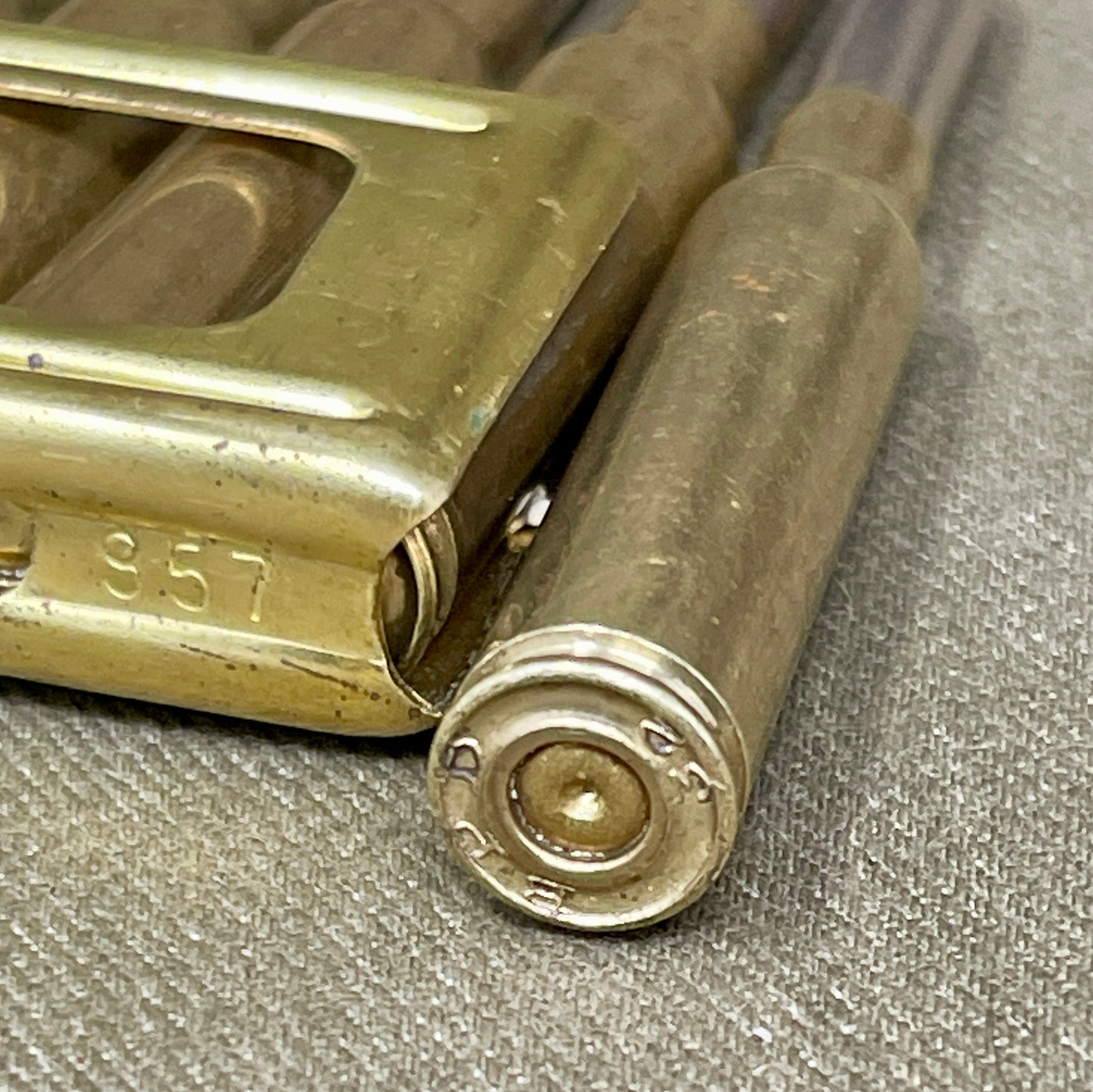 Close-up of a brass lock mechanism on a textured surface