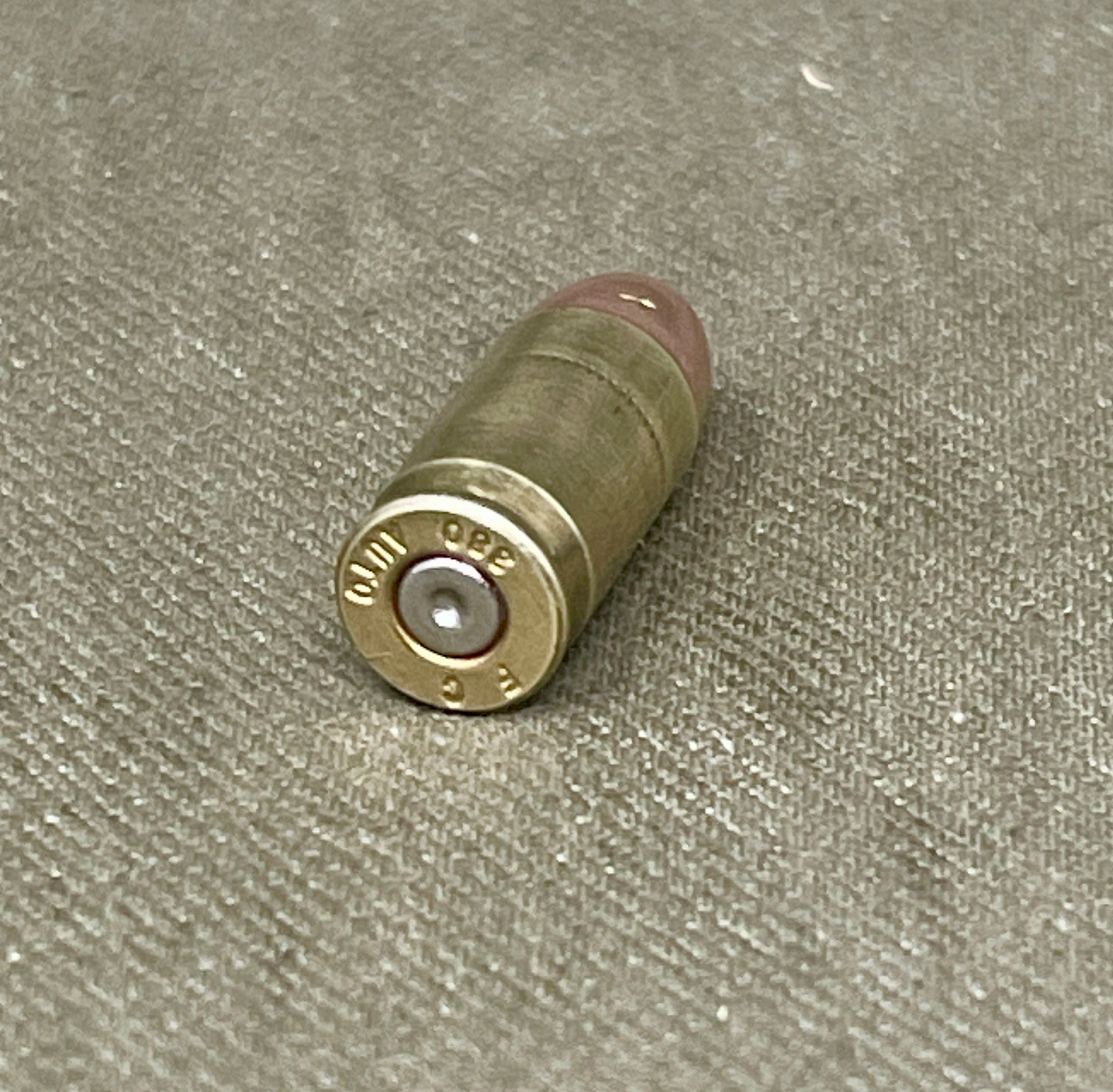 Bullet casing on a textured surface