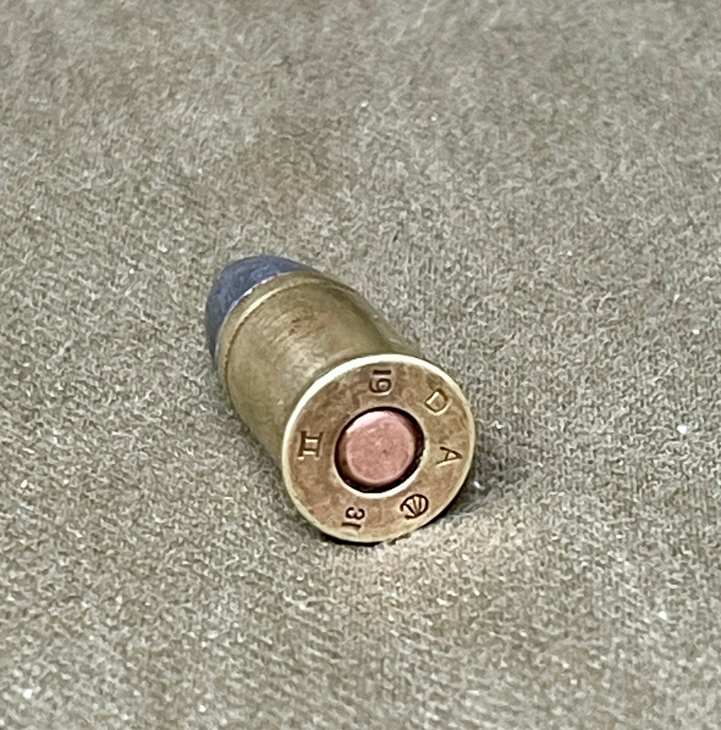 Bullet casing on a textured surface